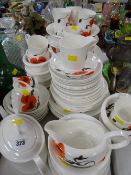 A large quantity of Wedgwood Susie Cooper design 'Corn Poppy' patterned tea & dinnerware