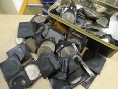 A vintage tin containing a large collection of Royal Commemorative crowns