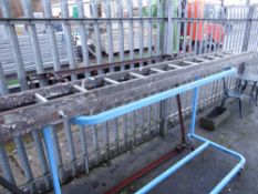 Set of vintage extending wooden ladders (outside)