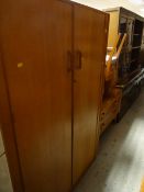 A good vintage lightwood E G by G-Plan bedroom suite comprising two-drawer wardrobe, mirrored