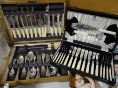 A wooden cased canteen of cutlery together with a cased set of fish knives & forks