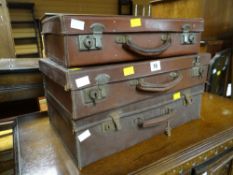 Three small vintage suitcases