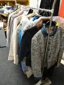 A rail of ladies' clothing, mainly coats & jackets etc