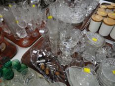 Two trays of various drinking glasses, other glassware, novelty bottled stoppers etc