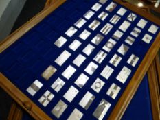A part cased set of John Pinches silver ingot Flags of the United Nation collection (48 in total)