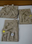 A trio of carved marble wall hangings depicting school lessons by local Welsh artist GWENDOLINE