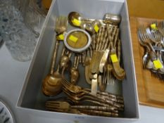 A box of gold effect bamboo-style handled flatware etc