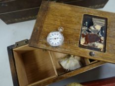 Small carved wooden music box (A/F) containing small silver ladies fob watch