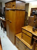 A vintage Crown Furniture bedroom suite comprising two-door wardrobe, chest of drawers, bedside