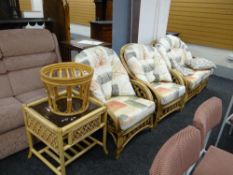 A bamboo & cane framed conservatory-style suite comprising two-seater sofa, two arm chairs, two