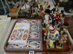 Twelve porcelain Napoleonic military figures, hardcover book of Uniforms of Waterloo, complete set