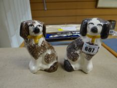 A pair of small Staffordshire dogs
