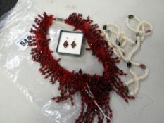 A string of freshwater pearls & red glass necklace & earrings