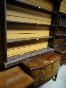 An antique mahogany bow-fronted compact chest with two-short above one-long drawer on raised