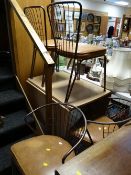 A retro-cool American Daystrom Formica topped drop leaf with twin metal legs table together with