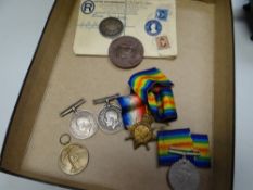 Group of five WWI medals, one WWII medal commemorative coins etc