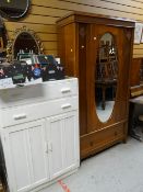 Mid twentieth century single mirror door wardrobe with single drawer base together with a painted