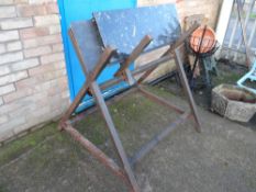 A welded metal sawhorse together with a slab of slate & a marble fire hearth (outside)