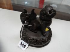 A Chinese bronze temple dog handled censer lid