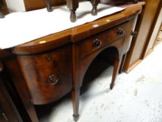 An antique Georgian mahogany & ebonized string decorated bow fronted sideboard