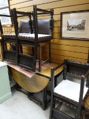 A good oak circular gate legged dining table together with six matching brown leatherette &
