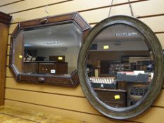 A vintage oak framed bevel wall mirror together with a vintage oval bevel wall mirror