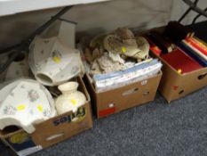 Two boxes of household items including table lamps, unused bed linen & table linen, collection of