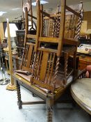A good vintage dark oak extending dining table with barley-twist legs & X stretchers together with a