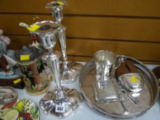 A parcel of EPNS including a pair of Walker & Hall EPNS tall candlesticks, circular tray, hip