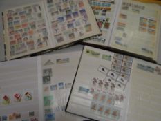 Four albums of mainly Commonwealth & Eastern European stamps