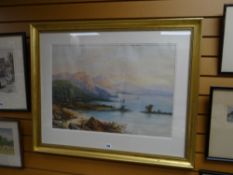 I WILSON watercolour - shoreline with figure, boats & mountain range, signed