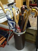 Parcel of sticks & umbrellas in a leather effect & metal banded stand including an early Hickory
