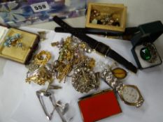 A box containing various wristwatches, costume jewellery, brooches etc