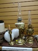Brass columned, glass painted reservoir oil lamp together with two others converted to electric