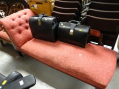 An Edwardian chaise longue upholstered in a red fabric