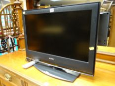 A Sony Bravia 23-inch flat screen television with control E/T