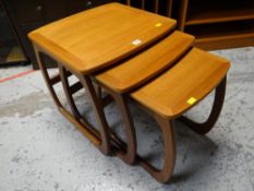 A vintage Parker Knoll teak nest of three tables