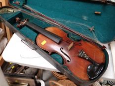 A vintage cased Maggini German made violin dated 1886