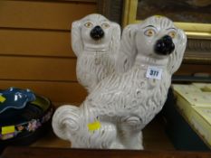 A pair of antique Staffordshire dogs