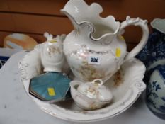 A four-piece pottery toilet set & two items of dressing tableware