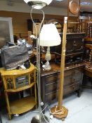 A modern brushed metal up lighter with reading light, vintage wooden standard lamp & an onyx