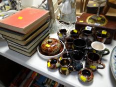 A quantity of small Ewenny pottery vases & mugs together with a Portmeirion Zodiac mug together with