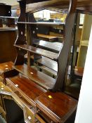 A vintage set of desktop drawers together with a small waterfall bookcase