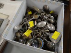 A box of various collector's spoons
