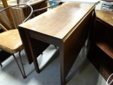 An antique oak drop leaf dining table