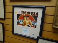 Framed Bruce Lee autographed film poster together with an animated film cell & drawings dated 1995