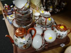 A Japanese export eggshell decorated teaset