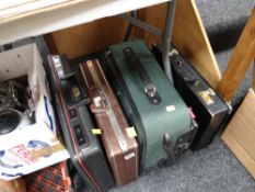 Three briefcases together with a small travel case