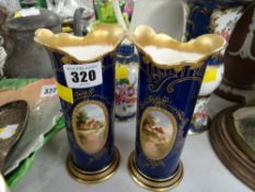 A pair of Royal Doulton blue & gold decorated spill vases