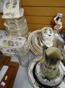 A quantity of vintage gilt & floral decorated dinnerware including tureens, platters, vintage